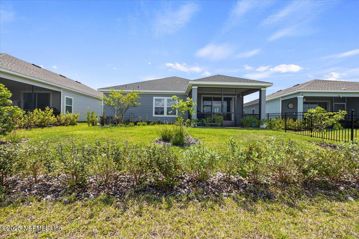 50 Dollar Court St. Augustine, FL 32092 - Photo 38 of 55 a front view of house with yard and green space