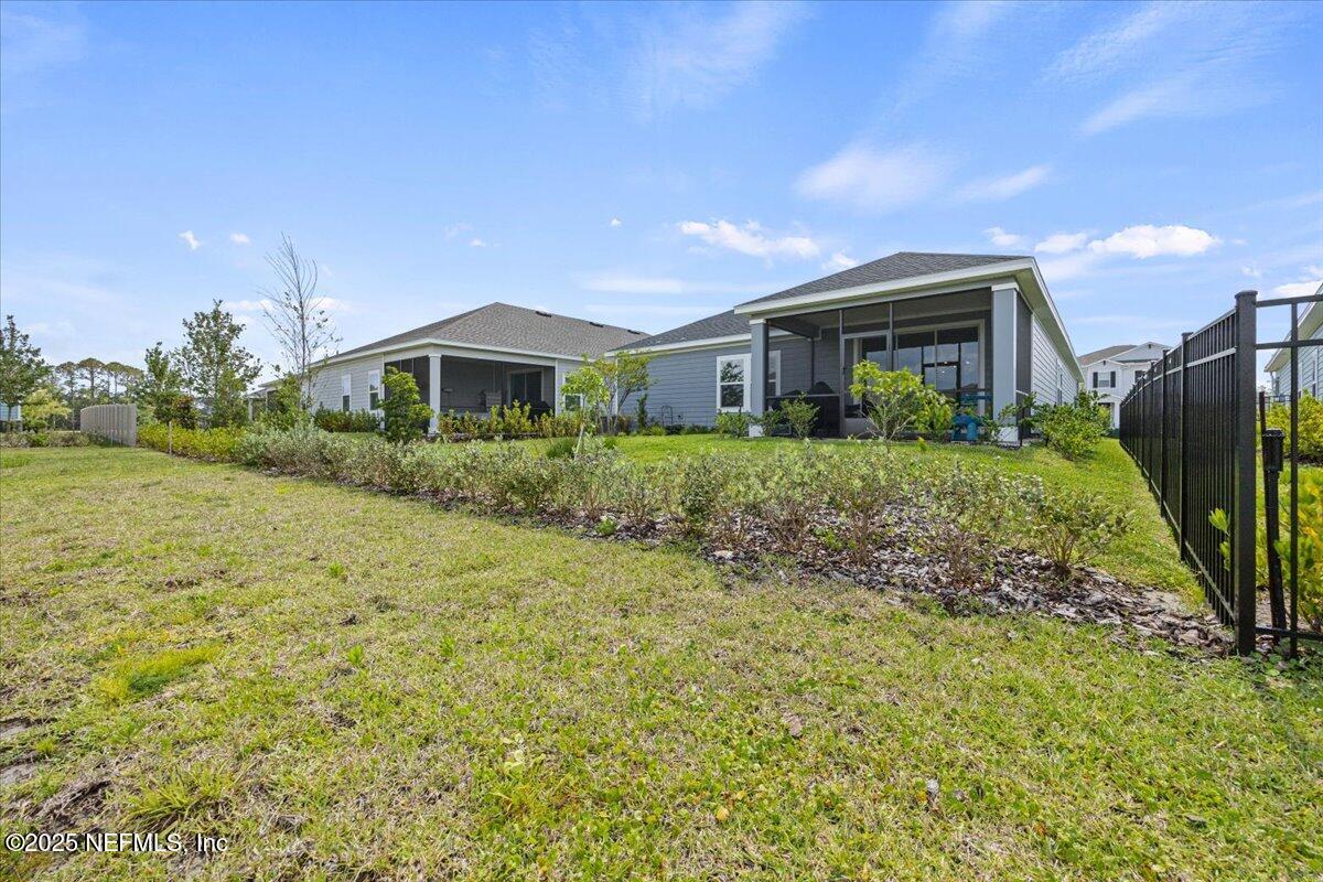 50 Dollar Court St. Augustine, FL 32092 - Photo 40 of 55 a front view of a house with a yard