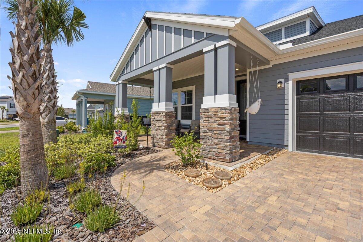 50 Dollar Court St. Augustine, FL 32092 - Photo 5 of 55 a front view of a house with a yard and garage