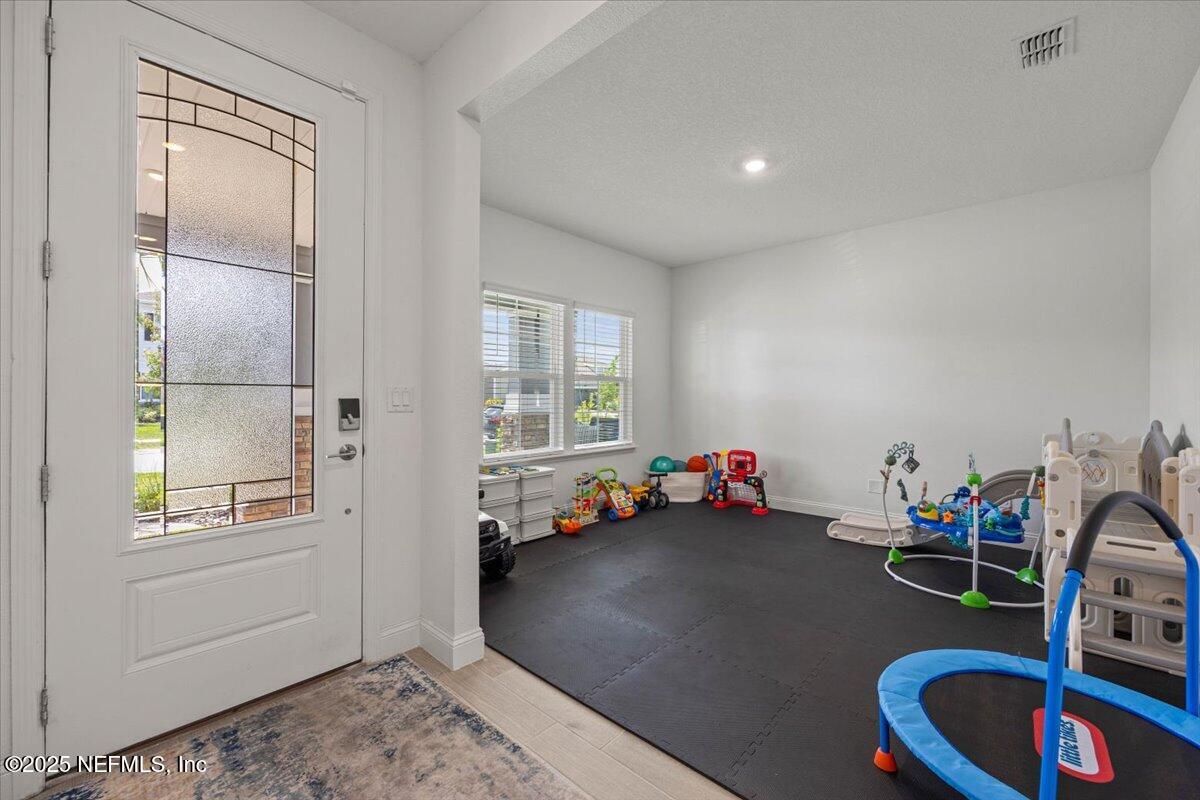 50 Dollar Court St. Augustine, FL 32092 - Photo 8 of 55 a bedroom with furniture and a wooden floor