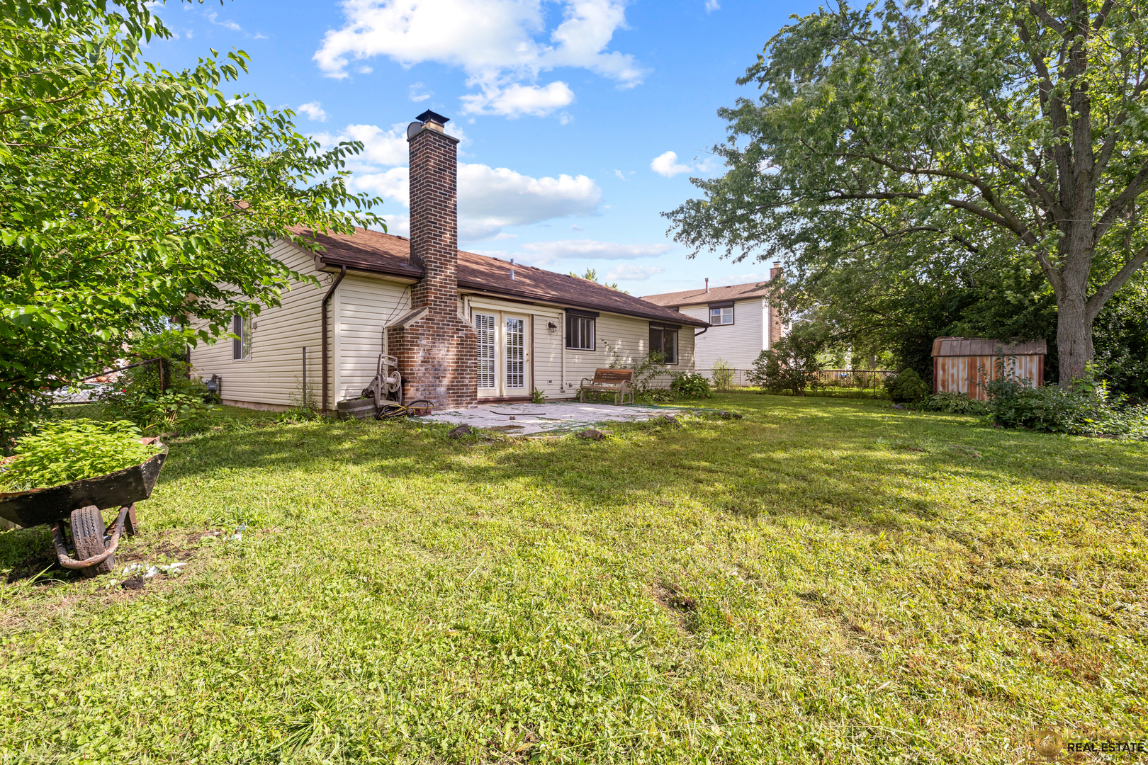 142 Cloverleaf Road Matteson, IL 60443 - Photo 21 of 22 a front view of a house with a yard garage and outdoor seating