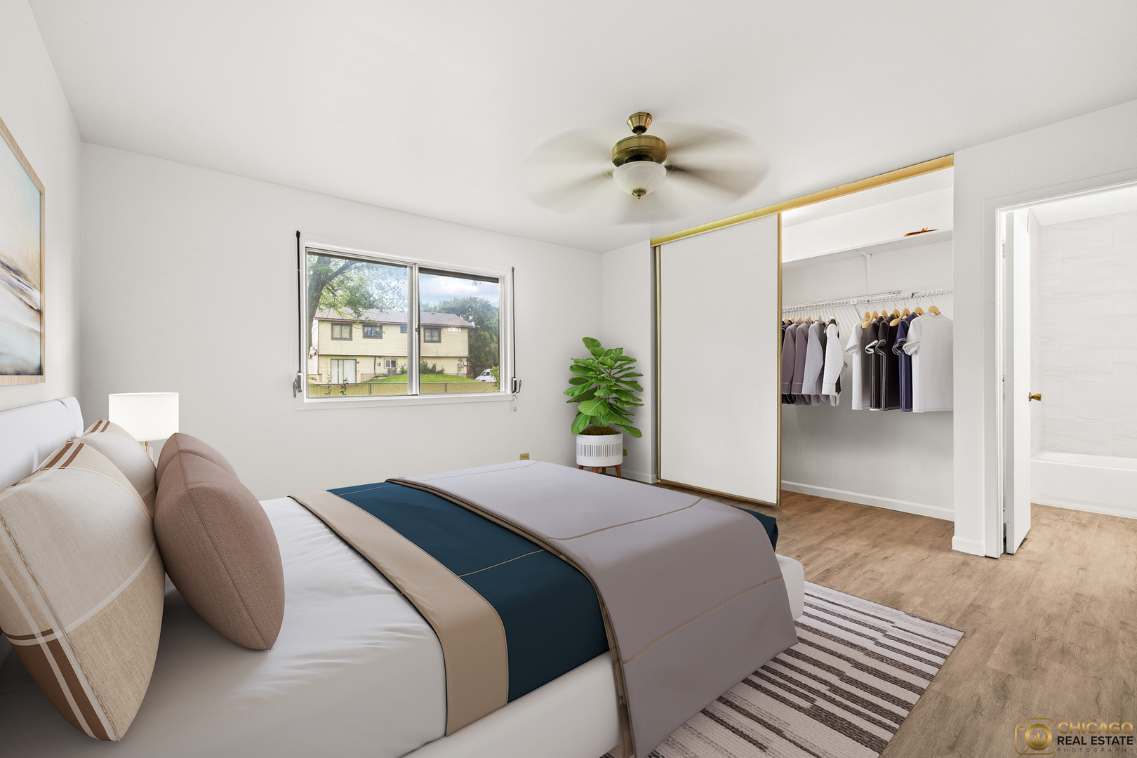 142 Cloverleaf Road Matteson, IL 60443 - Photo 10 of 22 a spacious bedroom with a bed and a chandelier