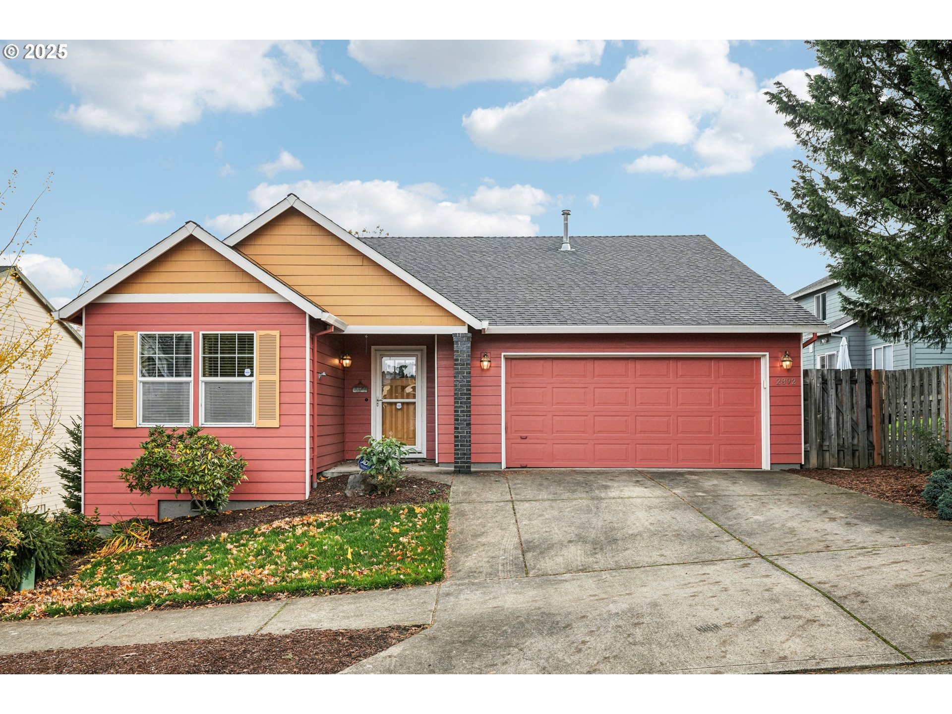 2892 Southeast Rosefinch Place Gresham, OR 97080 - Photo 1 of 37 a front view of a house with a yard and garage