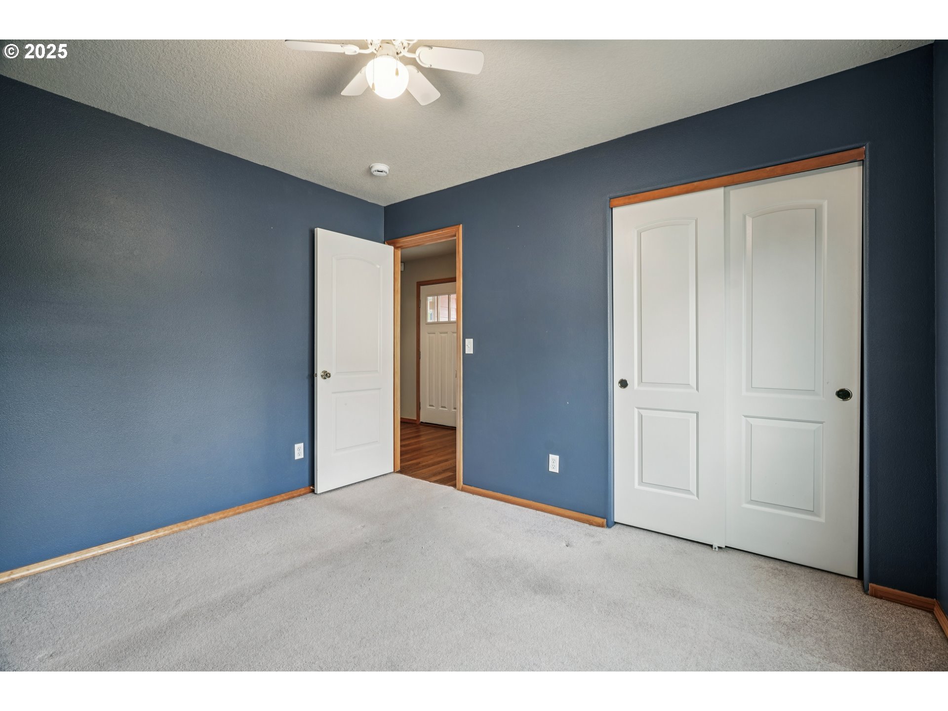 2892 Southeast Rosefinch Place Gresham, OR 97080 - Photo 20 of 37 a view of an empty room with a ceiling fan