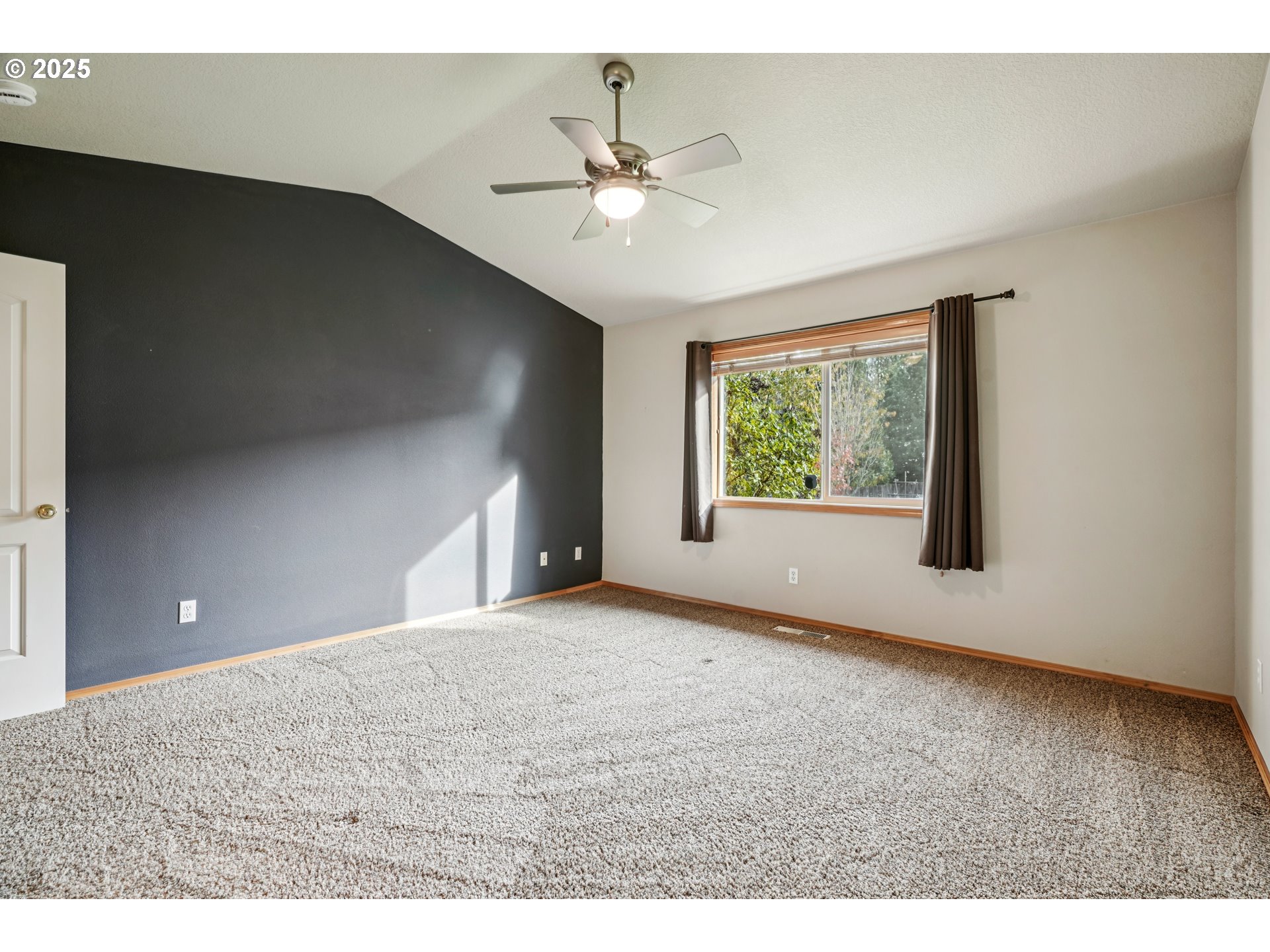 2892 Southeast Rosefinch Place Gresham, OR 97080 - Photo 23 of 37 a view of a livingroom with a ceiling fan and window