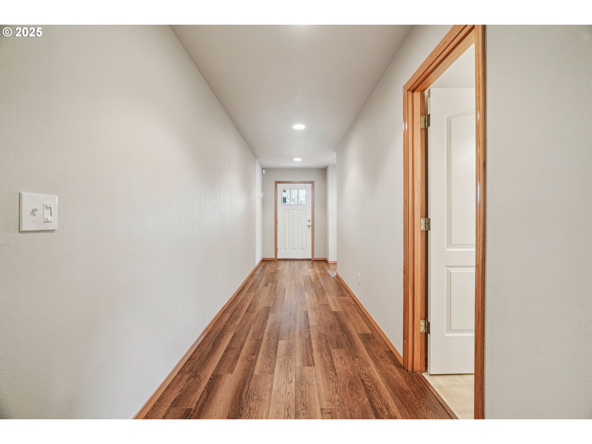 2892 Southeast Rosefinch Place Gresham, OR 97080 - Photo 4 of 37 a view of hallway with wooden floor