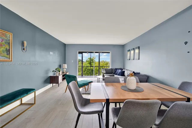 a view of a dining room with furniture window and outside view