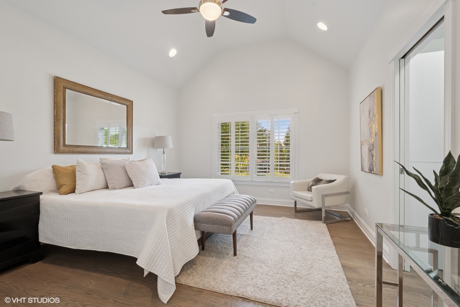 1635 Elder Lane Northfield, IL 60093 - Photo 11 of 30 a bedroom with a large bed and a chandelier