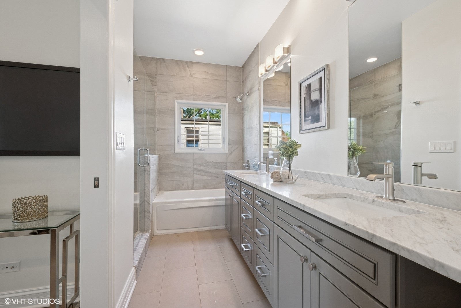 1635 Elder Lane Northfield, IL 60093 - Photo 12 of 30 a spacious bathroom with a granite countertop sink mirror and bathtub