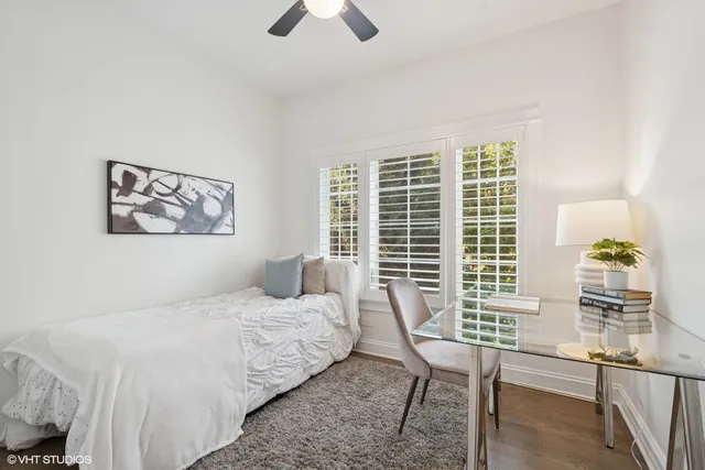 a bedroom with furniture and a window