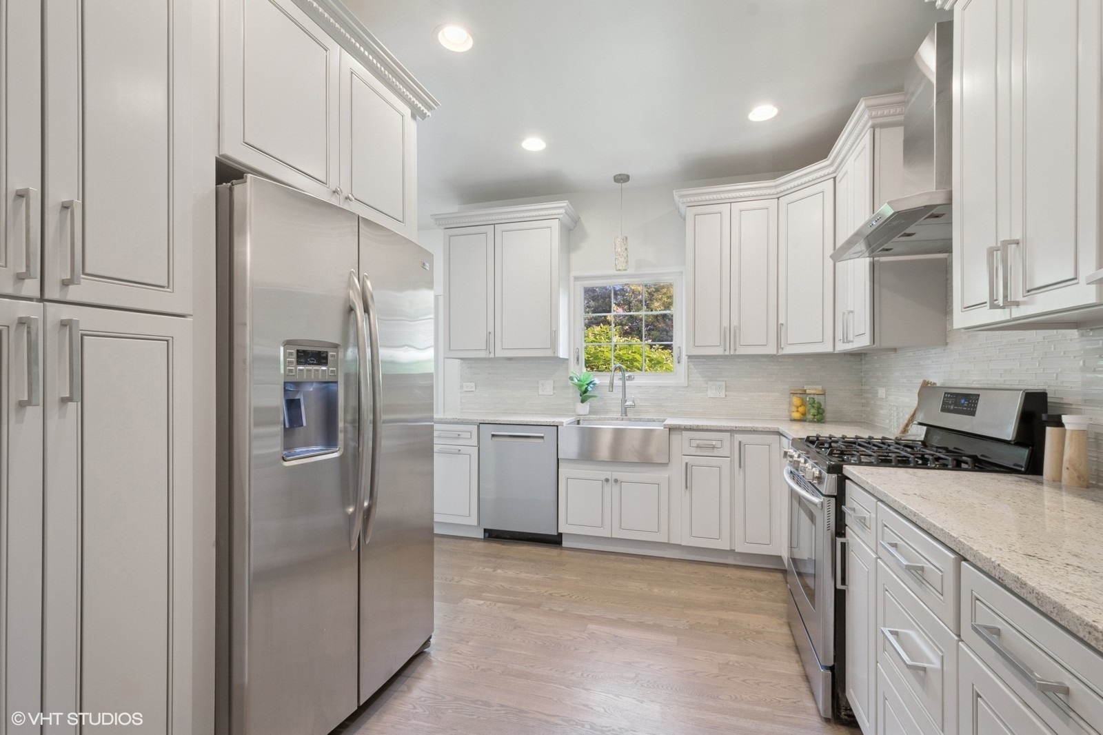 1635 Elder Lane Northfield, IL 60093 - Photo 4 of 30 a kitchen with cabinets and stainless steel appliances