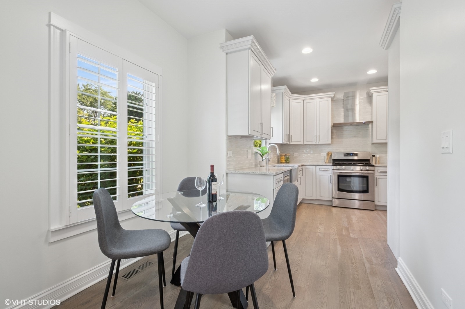 1635 Elder Lane Northfield, IL 60093 - Photo 5 of 30 a kitchen with granite countertop white cabinets and stainless steel appliances