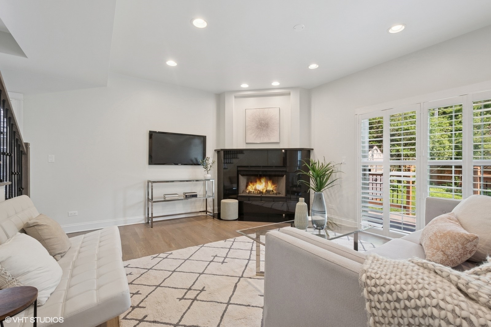 1635 Elder Lane Northfield, IL 60093 - Photo 7 of 30 a living room with furniture a flat screen tv and a fireplace