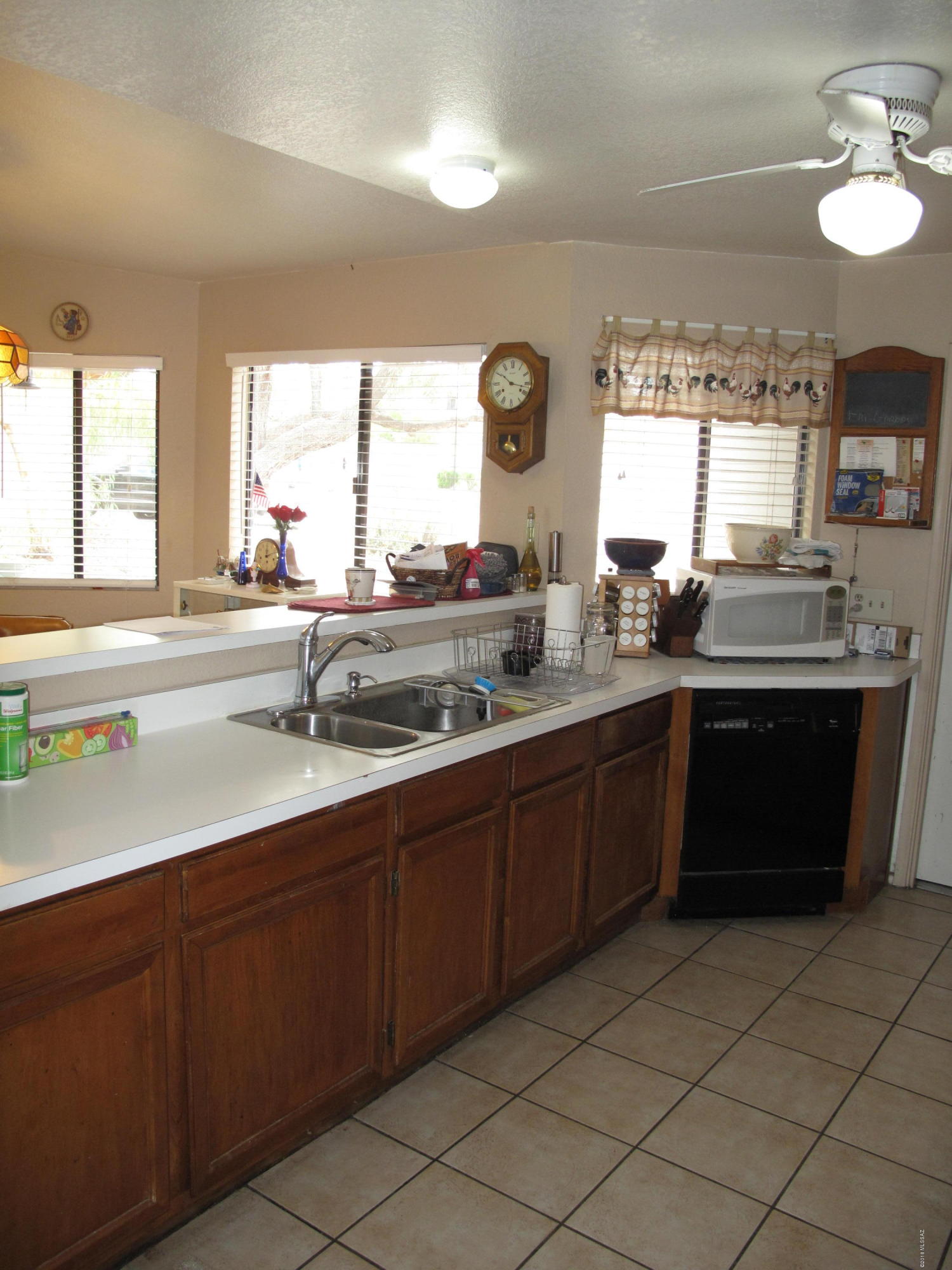 2520 West Fanbrook Road Tucson, AZ 85741 - Photo 9 of 18 a kitchen with a sink stove and cabinets