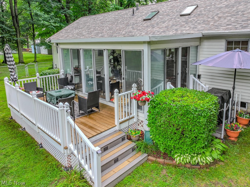 1966 Spring Grove Madison, OH 44057 - Photo 12 of 50 Seller's added on this deck off the Sunroom