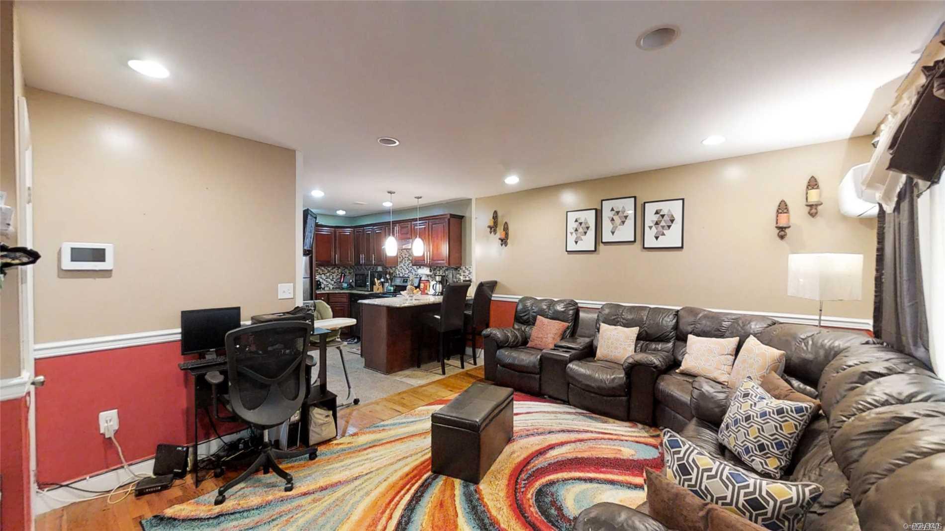 176-32 133rd Road Queens, NY 11434 - Photo 3 of 11 a living room with furniture a piano and a flat screen tv