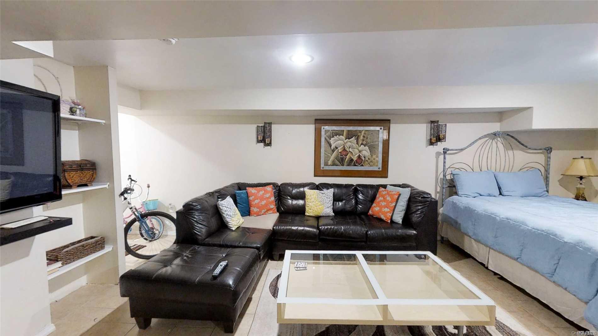 176-32 133rd Road Queens, NY 11434 - Photo 9 of 11 a living room with furniture