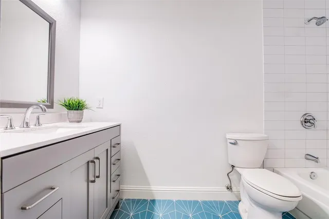 a bathroom with a sink toilet and vanity