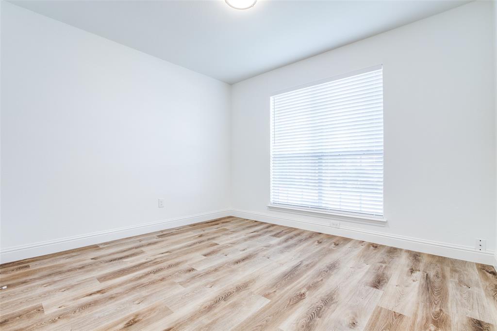 8341 Edgewater Drive Frisco, TX 75034 - Photo 18 of 22 an empty room with a window