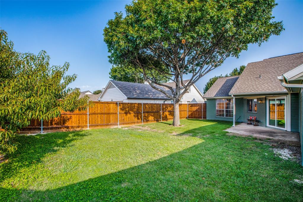 8341 Edgewater Drive Frisco, TX 75034 - Photo 20 of 22 a view of house with a big yard and large trees