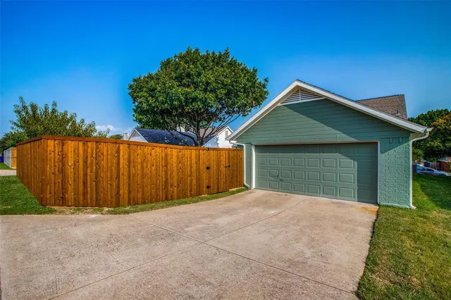 a front view of a house with a garage