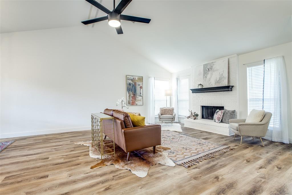8341 Edgewater Drive Frisco, TX 75034 - Photo 6 of 22 a living room with furniture and a fireplace