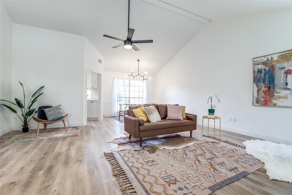 8341 Edgewater Drive Frisco, TX 75034 - Photo 7 of 22 a living room with furniture and a wooden floor