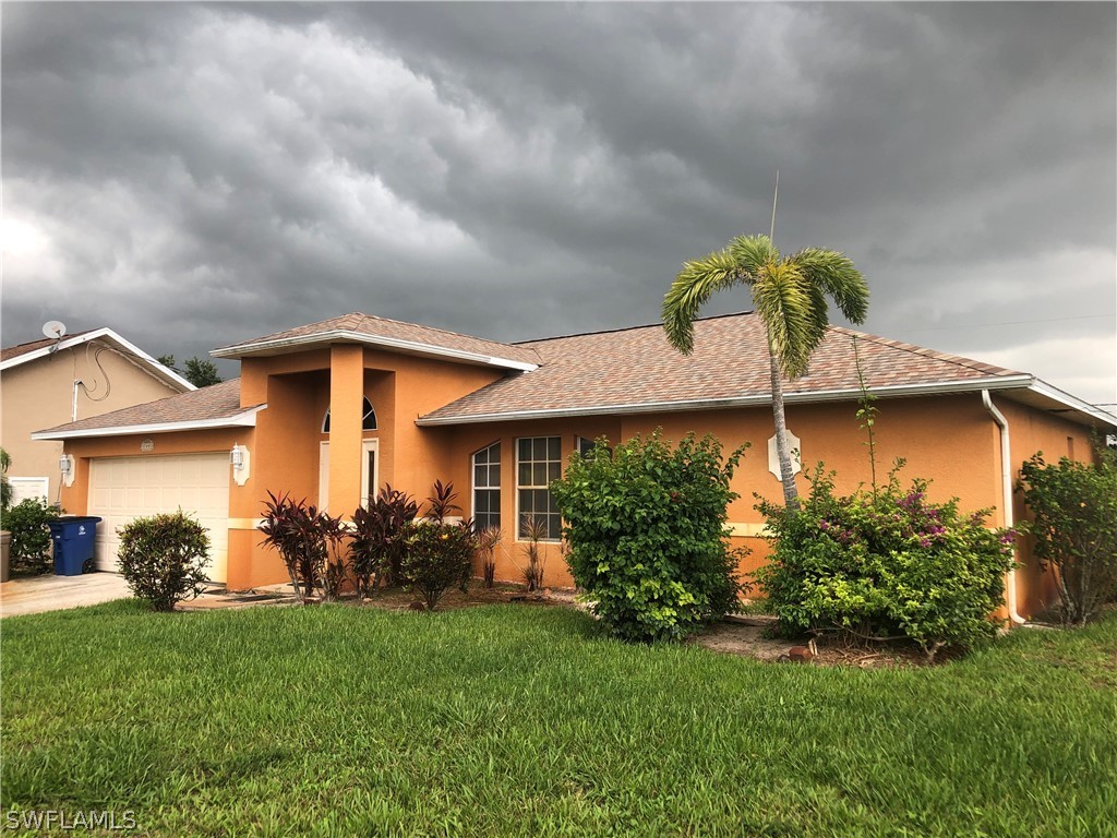 17441 Braddock Road Fort Myers, FL 33967 - Photo 3 of 29 a front view of house with yard and green space