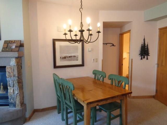 129 River Run Road, Unit 8036 Keystone, CO 80435 - Photo 3 of 20 a view of a dining room with furniture window and wooden floor