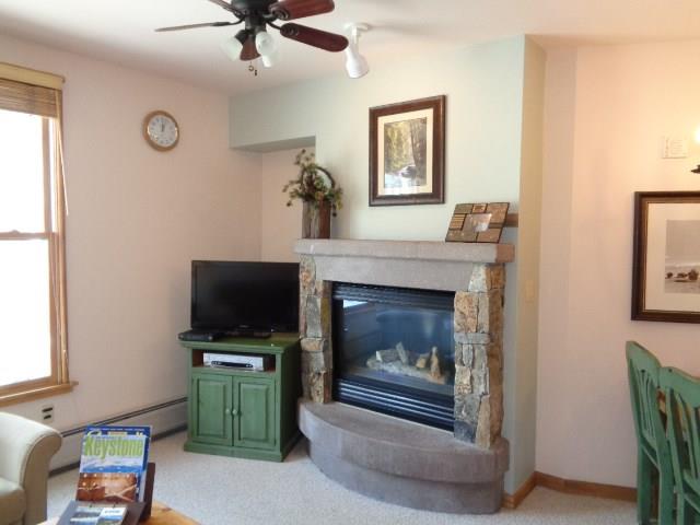 129 River Run Road, Unit 8036 Keystone, CO 80435 - Photo 6 of 20 a living room with furniture and a fireplace