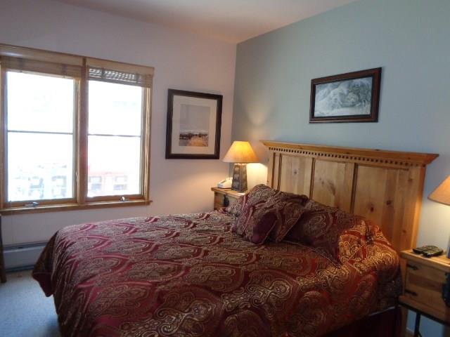 129 River Run Road, Unit 8036 Keystone, CO 80435 - Photo 7 of 20 a bed sitting in a bedroom next to a window