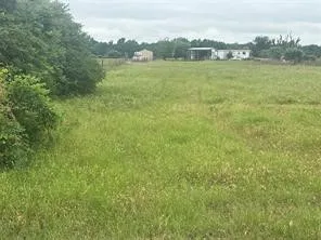 a view of a large body of water with a building in the background