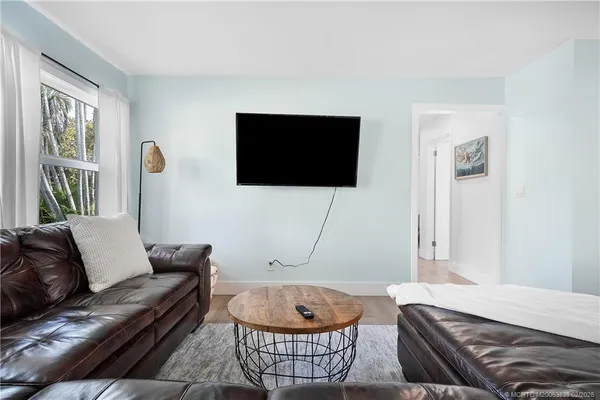 a living room with a couch and a flat screen tv