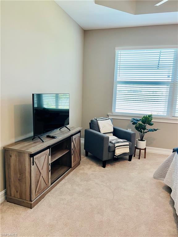 14715 Kelson Circle Naples, FL 34114 - Photo 12 of 35 a living room with furniture and a flat screen tv