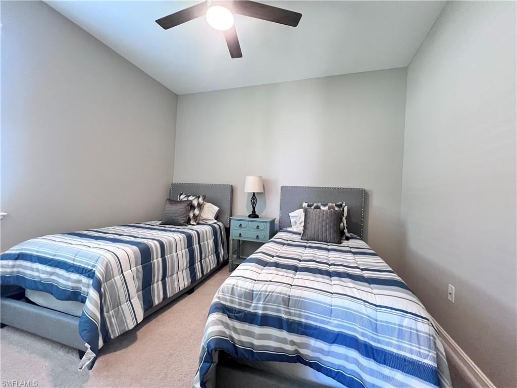 14715 Kelson Circle Naples, FL 34114 - Photo 14 of 34 a bedroom with two beds and painting on the wall