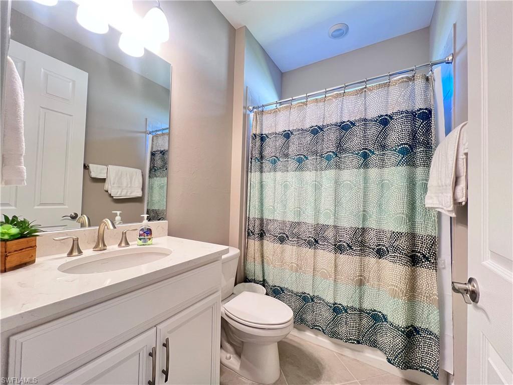 14715 Kelson Circle Naples, FL 34114 - Photo 15 of 34 a bathroom with a sink toilet and shower