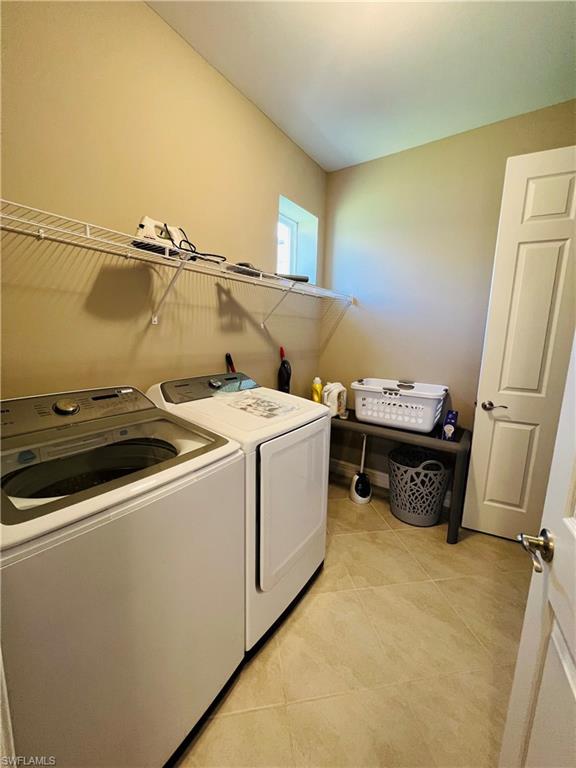 14715 Kelson Circle Naples, FL 34114 - Photo 16 of 35 a utility room with dryer and washer