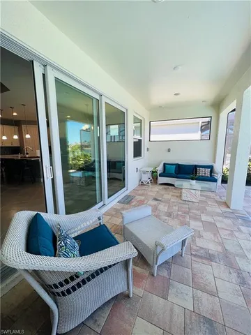 a living room with furniture rug and a table
