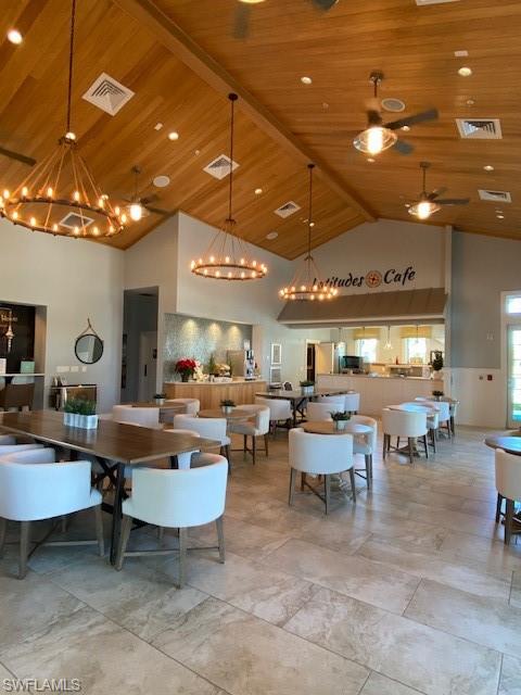 14715 Kelson Circle Naples, FL 34114 - Photo 22 of 35 a living room with lots of furniture and view of a projector