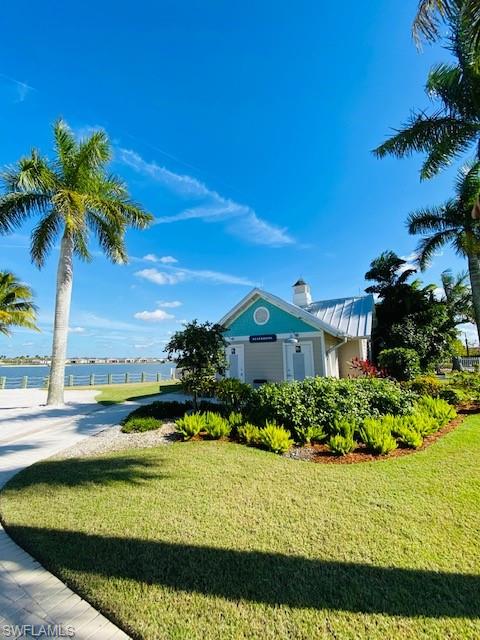 14715 Kelson Circle Naples, FL 34114 - Photo 29 of 34 a view of a large body of water with a building in the background