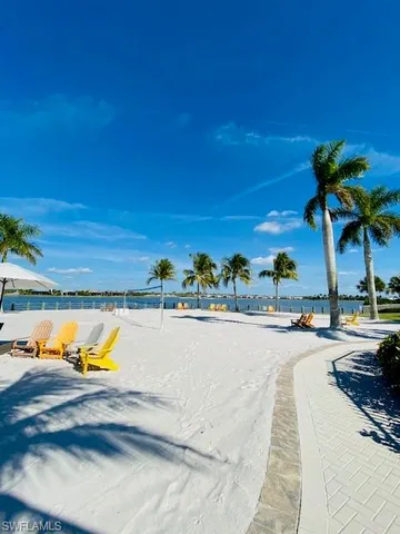 a view of a swimming pool and lounge chair