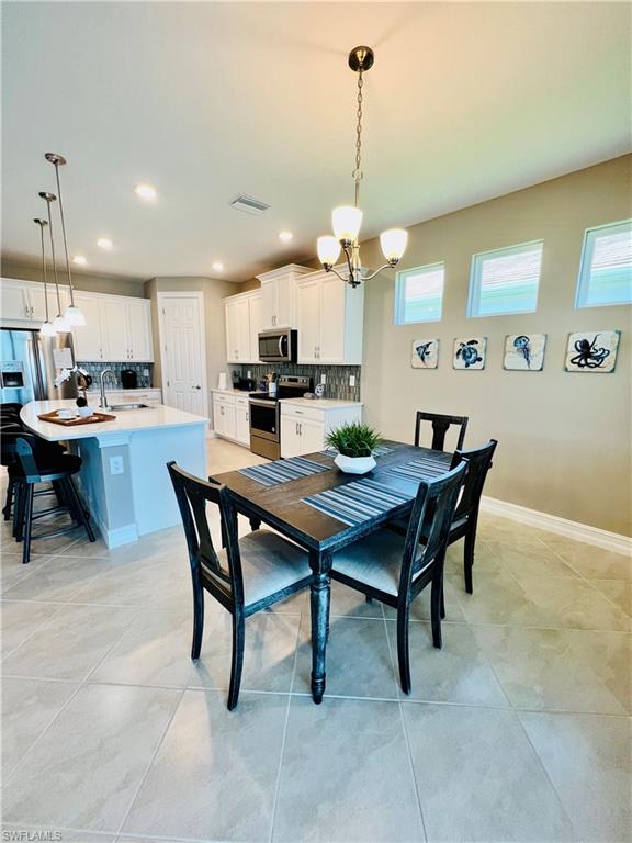 14715 Kelson Circle Naples, FL 34114 - Photo 4 of 35 a view of a dining room and livingroom