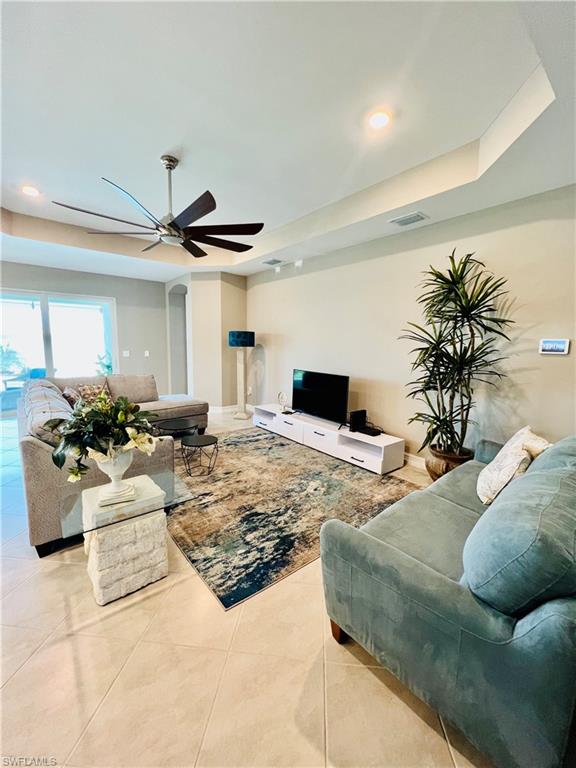 14715 Kelson Circle Naples, FL 34114 - Photo 5 of 35 a living room with furniture and a large window