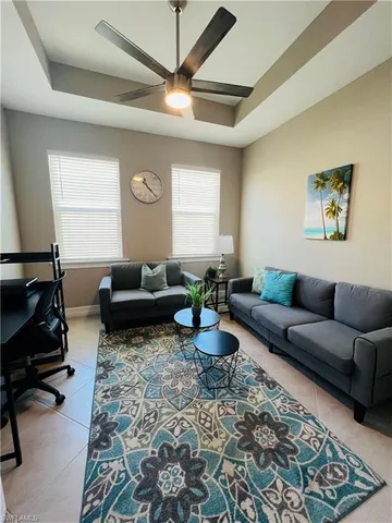 a living room with furniture and a rug