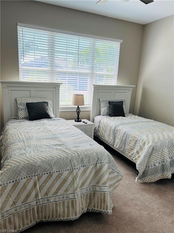 14715 Kelson Circle Naples, FL 34114 - Photo 8 of 35 a bedroom with two beds and a fireplace