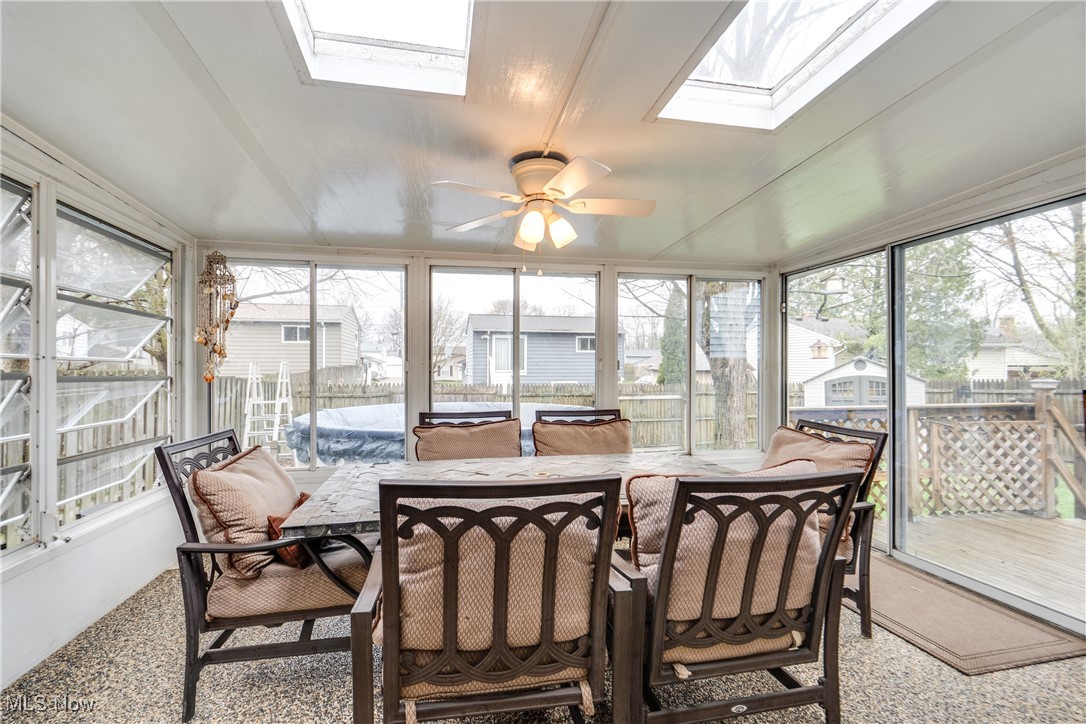 5844 Ridgeview Boulevard North Ridgeville, OH 44039 - Photo 7 of 28 Sunroom / solarium with a skylight, outdoor dining space, and ceiling fan
