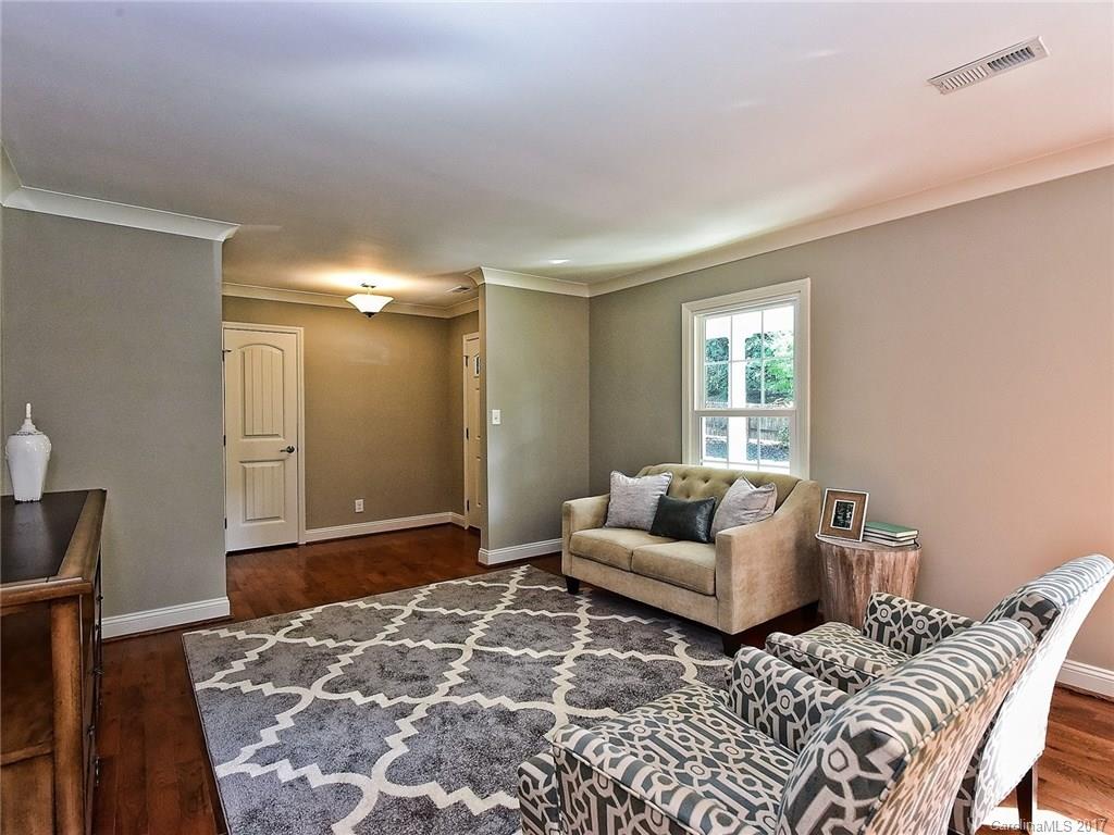 4116 Randolph Road Charlotte, NC 28211 - Photo 3 of 24 a bedroom with a bed and wooden floor