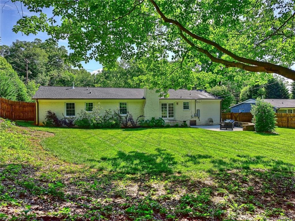 4116 Randolph Road Charlotte, NC 28211 - Photo 22 of 24 a front view of a house with a yard and green space