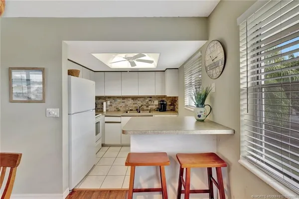 a view of kitchen with breakfast area