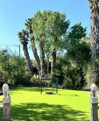 a view of swimming pool with a yard
